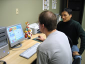 adult student going over this week's vocabularies with the help of computer